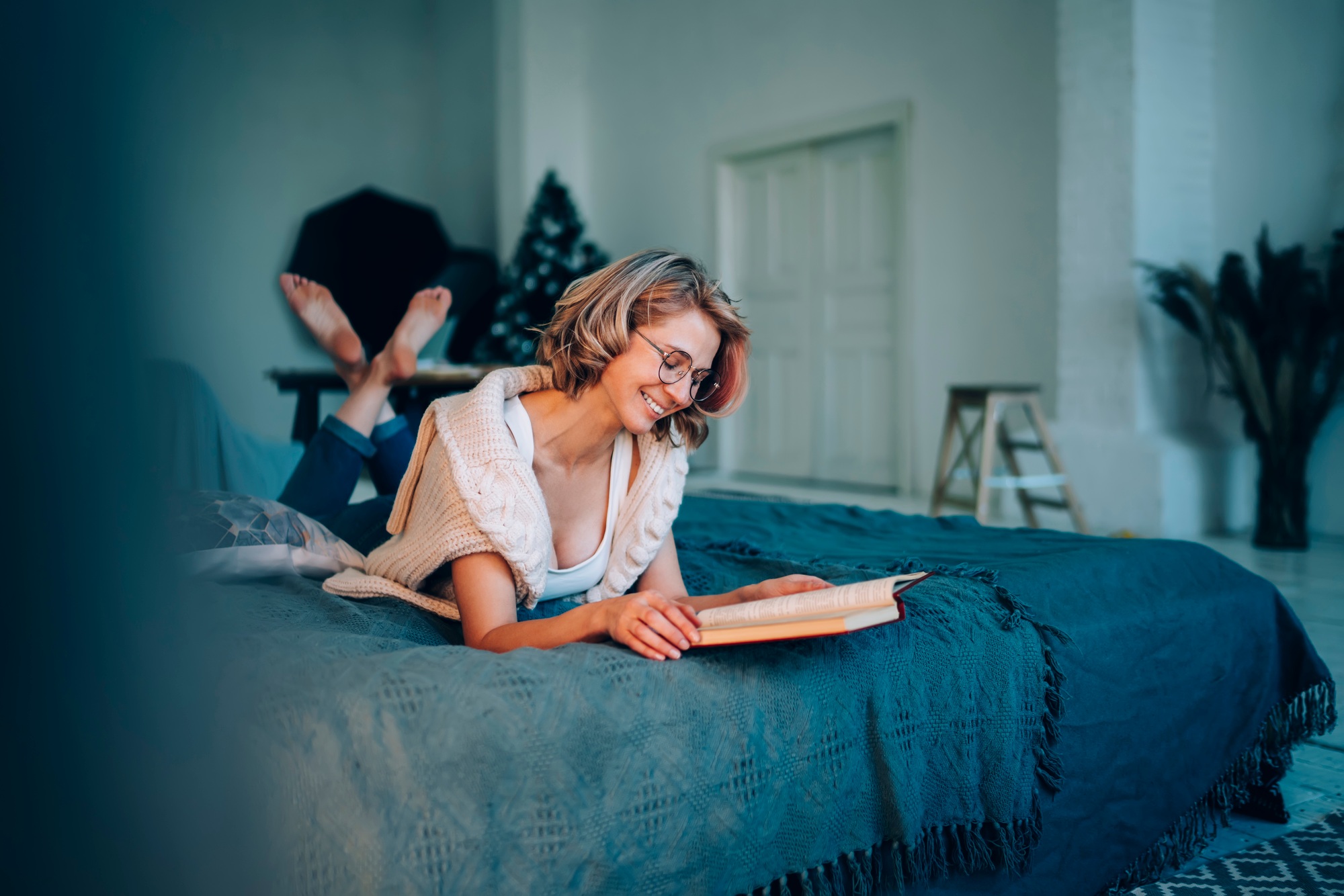cheerful woman in spectacles enjoying rest