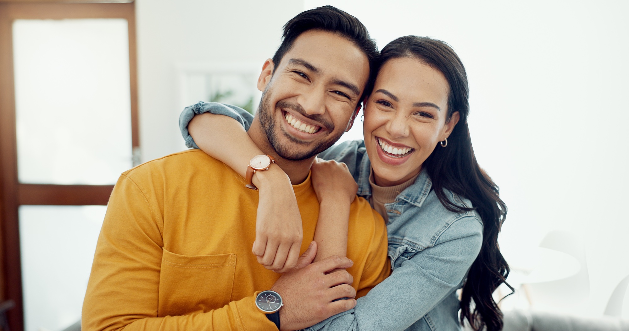 Couple, hug in portrait and relax in lounge with love, bonding and happy people together at home. H