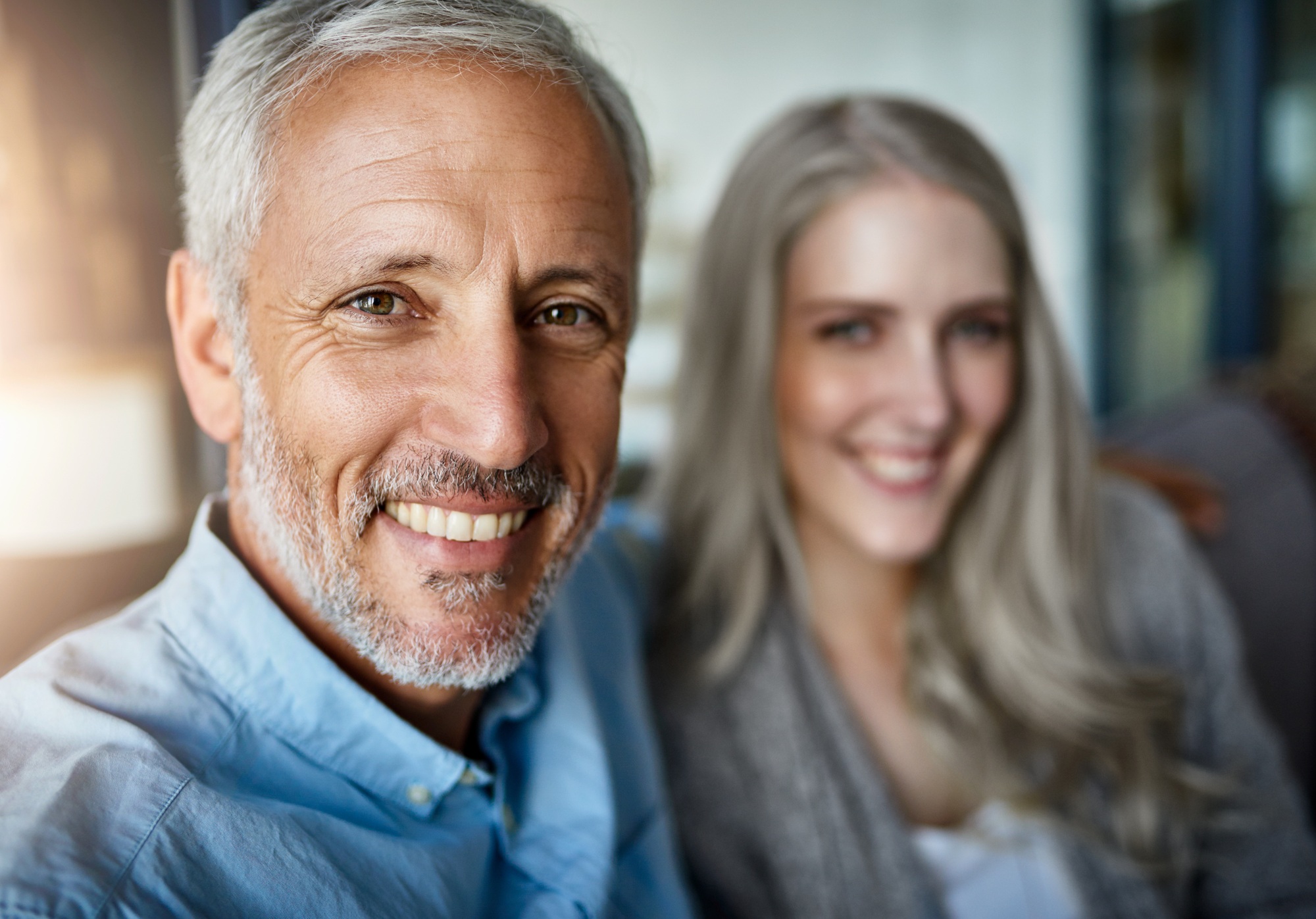 Enjoying a relaxing day together. Portrait of a happy couple relaxing together at home.